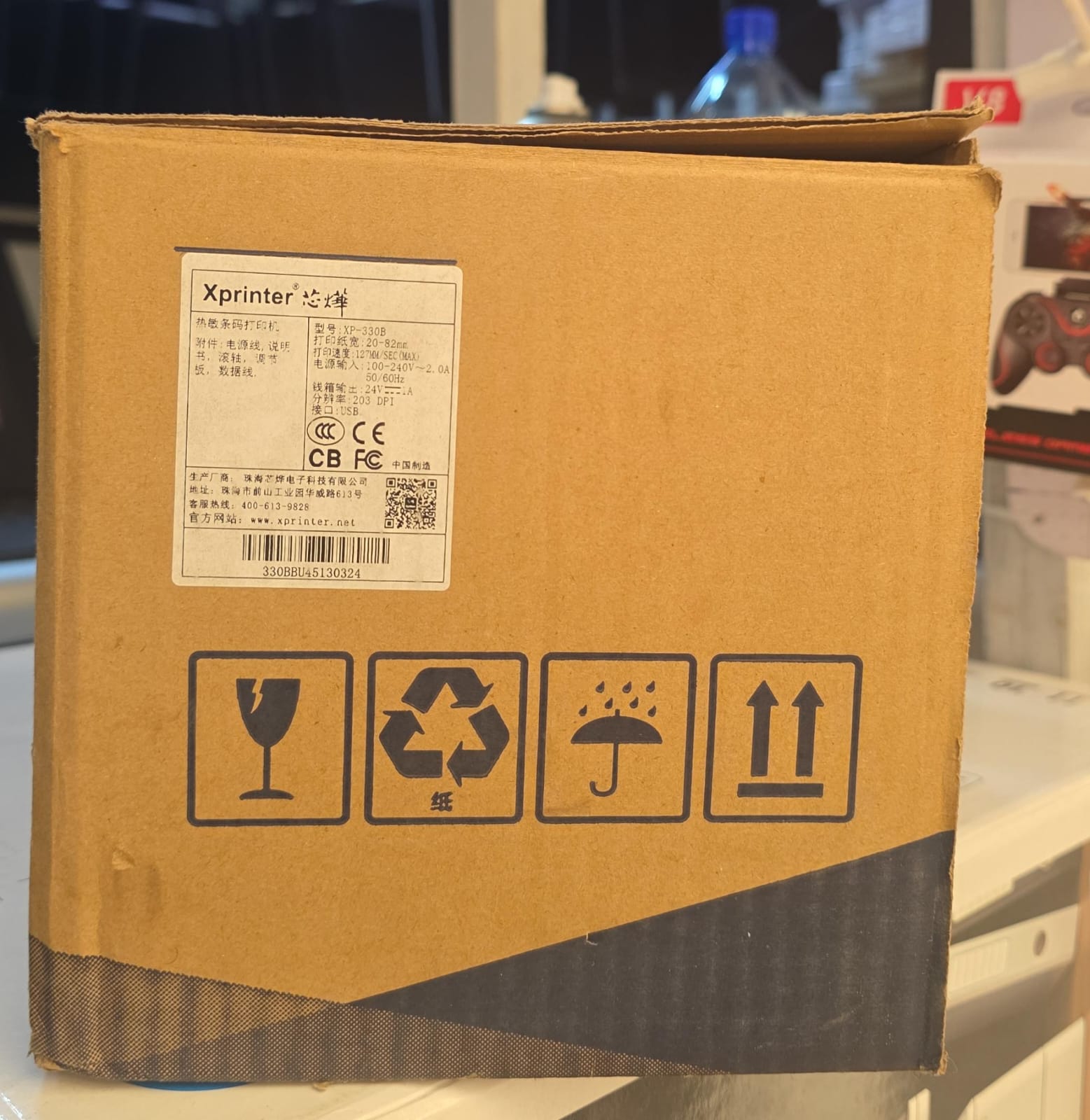 The Xprinter XP-330B is a 2-in-1 direct thermal printer designed to handle both barcode labels and POS receipts.